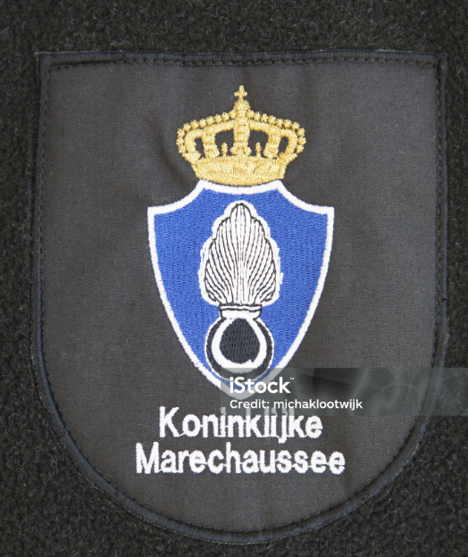 Close-up of custom logo embroidery on a corporate uniform shirt, showing precise thread work and brand color matching by Divine Uniform's in-house embroidery unit